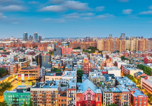 Lower East Side aerial view towards Brooklyn at twilight in New York, New York, USA.